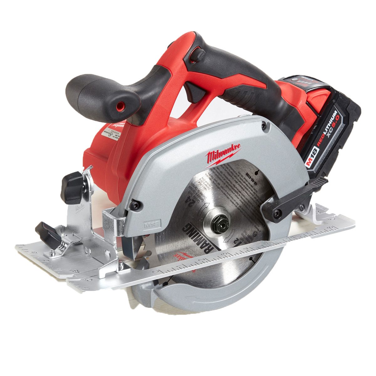 A circular saw rests on a flat surface, showcasing its rotating blade and ergonomic handle, ready for cutting tasks in a workshop or construction setting.