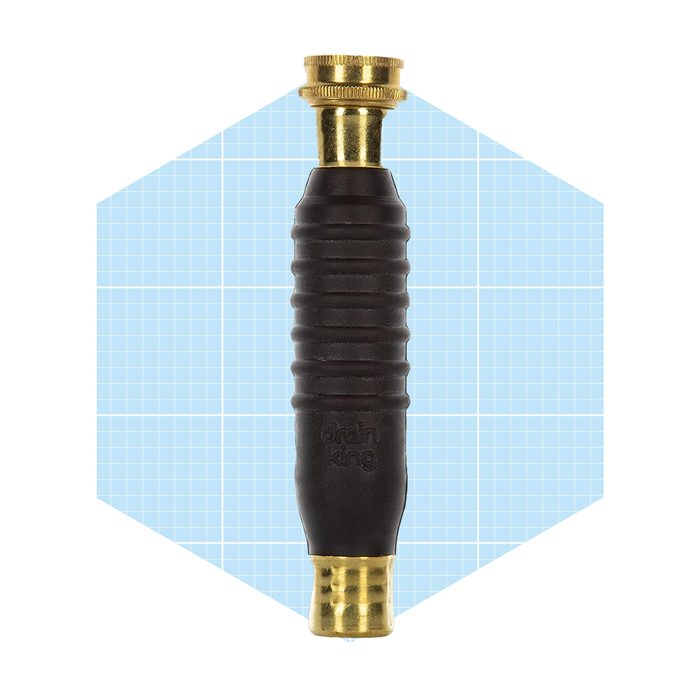 A black rubber handle with brass fittings is positioned vertically against a light blue grid background, suggesting it's a faucet or plumbing tool.