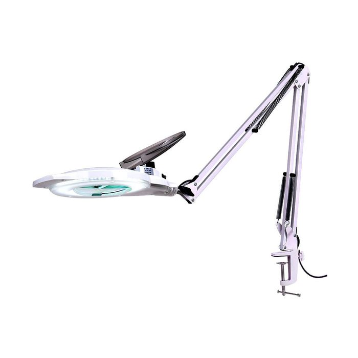 A magnifying lamp with an adjustable arm is positioned for close examination of small objects, typically used in detailed craft or beauty work.