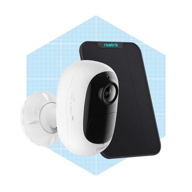 A white security camera mounts on a wall, capturing images, with a black panel in the background, set against a light blue grid pattern.