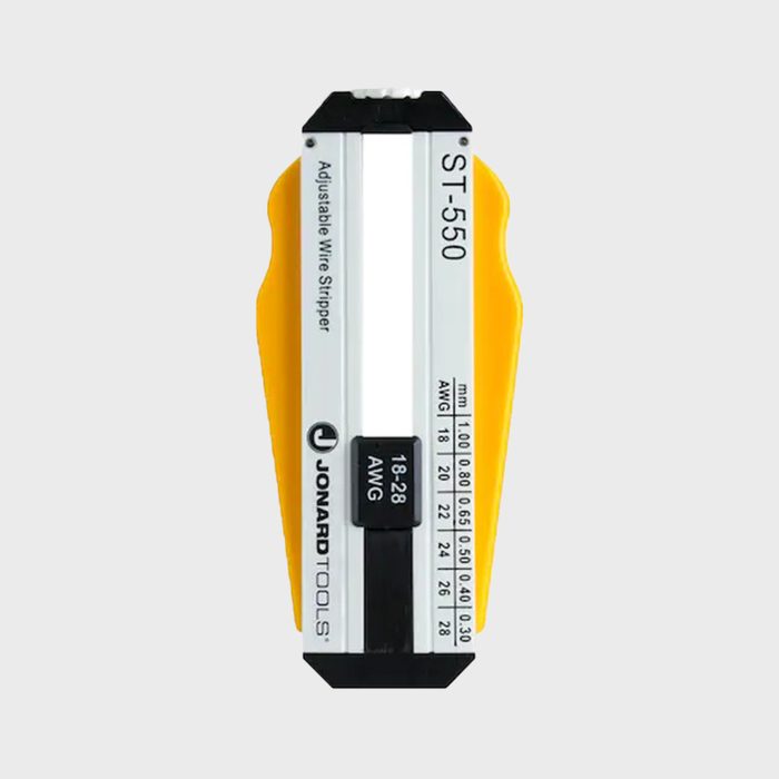 A yellow and silver adjustable wire stripper displays measurement markings for wire gauges, indicating its purpose for stripping insulation from electrical wires.