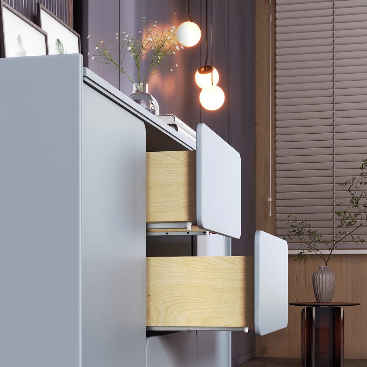 A grey cabinet with open wooden drawers sits under glowing pendant lights, surrounded by decorative elements and a vase on a side table.