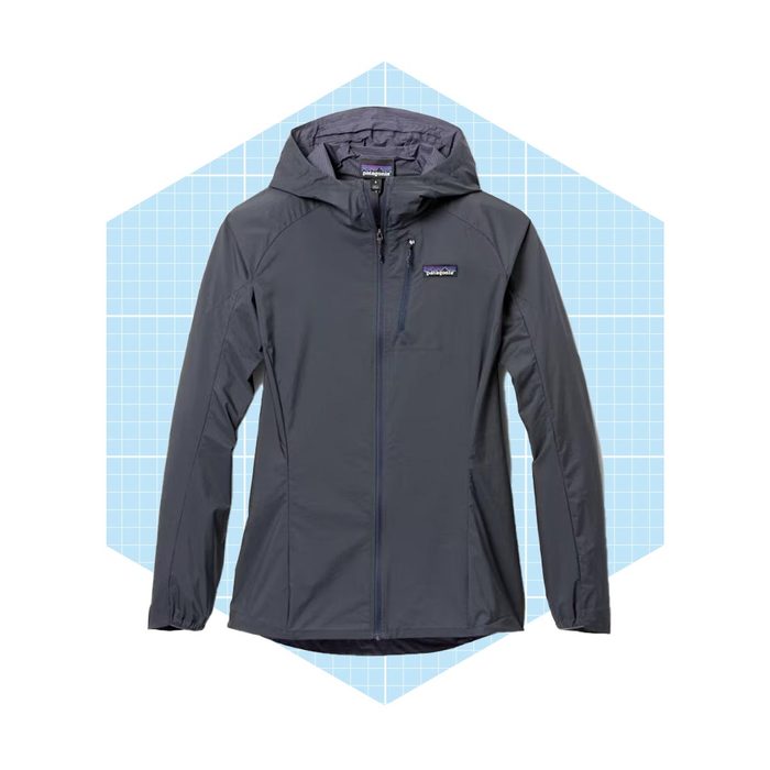 A navy hooded jacket is displayed against a light blue grid background, highlighting its sleek design and functional zipper.