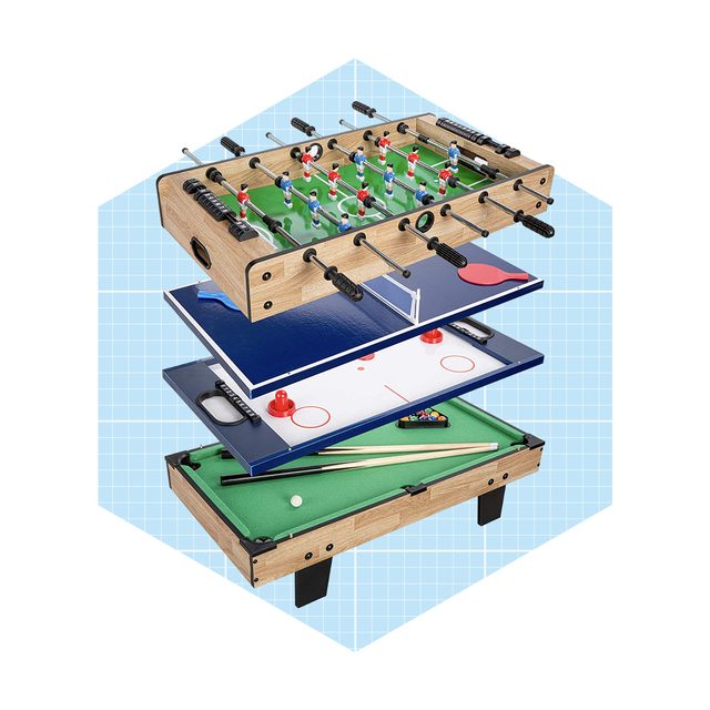 A multi-game tabletop features foosball, air hockey, and pool components, stacked with visible playing surfaces and accessories against a light blue grid background.