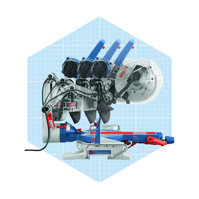 A miter saw with multiple blades, positioned on a base, is ready to cut materials. The background features a light blue grid pattern.