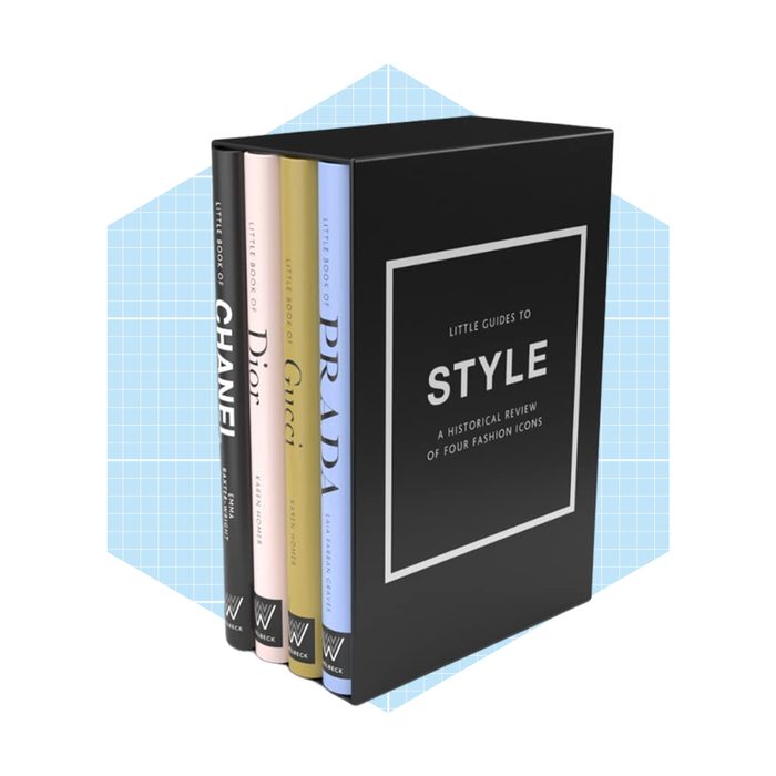 A black box set contains four books on fashion icons, titled 
