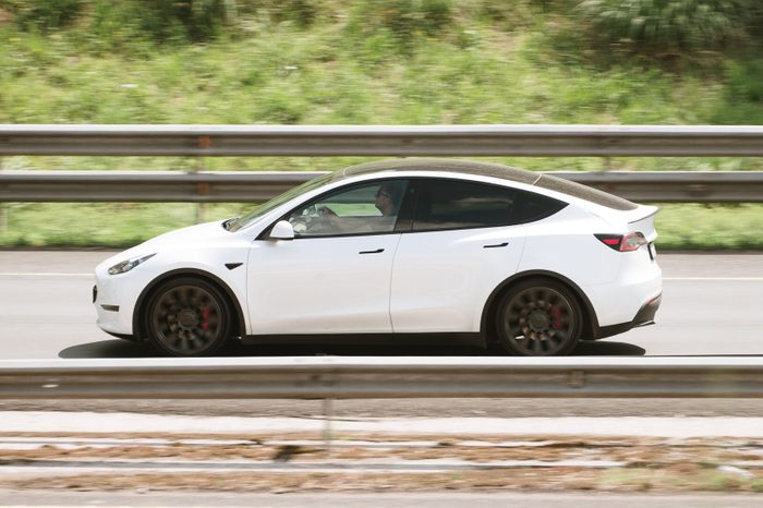 Tesla Model Y driving on a highway